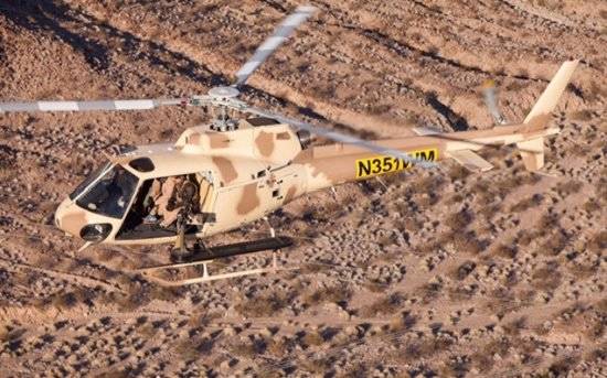 A helicopter flies over the Gunship Helicopters site in Sandy Valley, Nevada. (courtesy)