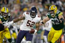 Chicago Bears' Khalil Mack intercepts a pass and returns it for a touchdown during the first ha ...