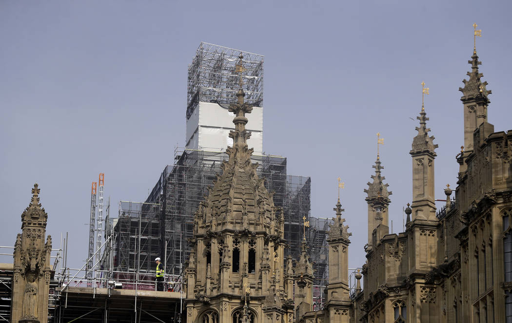 Britain's Houses of Parliament, covered in hoarding and scaffolding on Wednesday, April 17, 201 ...