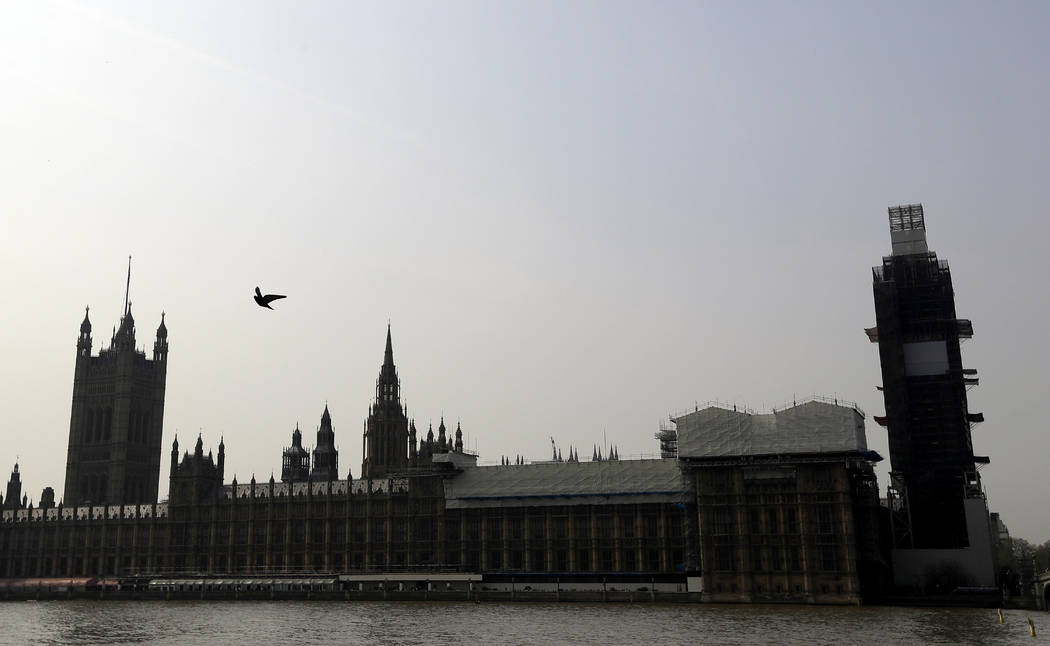 Britain's Houses of Parliament, covered in hoarding and scaffolding Wednesday, April 17, 2019, ...