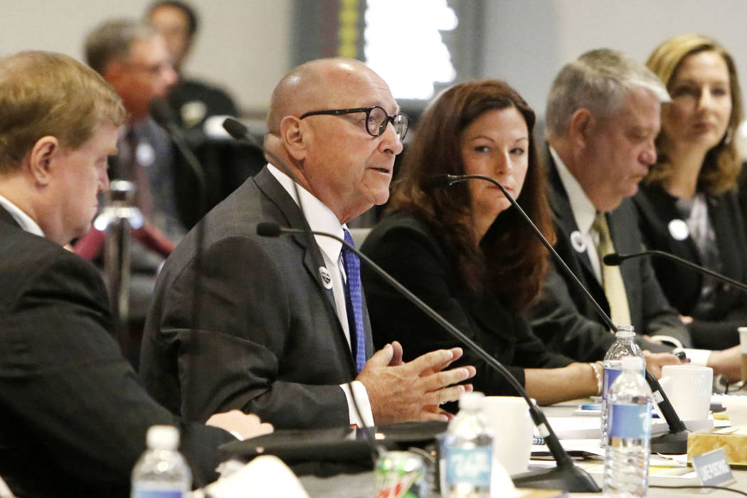 Rossi Ralenkotter, second left, then-president and CEO of the Las Vegas Convention and Visitors ...