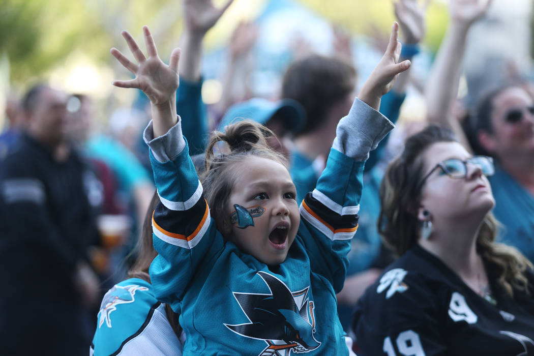 Kensei Calvert, 4, of San Jose, waves his hands outside of Sap Center in San Jose, Calif., befo ...