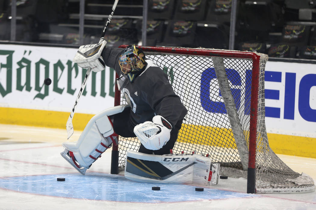 Vegas Golden Knights goaltender Marc-Andre Fleury (29) makes a stop during a team practice befo ...