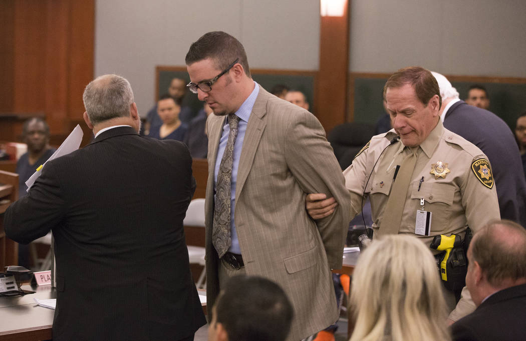 Defense lawyer Brian Bloomfield is taken into custody March 7, 2016, at the conclusion of a sen ...