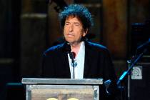 In this Feb. 6, 2015 file photo, Bob Dylan accepts the 2015 MusiCares Person of the Year award ...