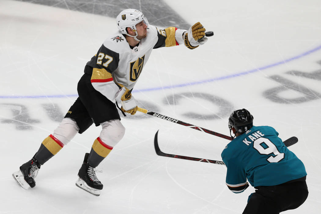 Vegas Golden Knights defenseman Shea Theodore (27) reaches for a puck in the air against San Jo ...