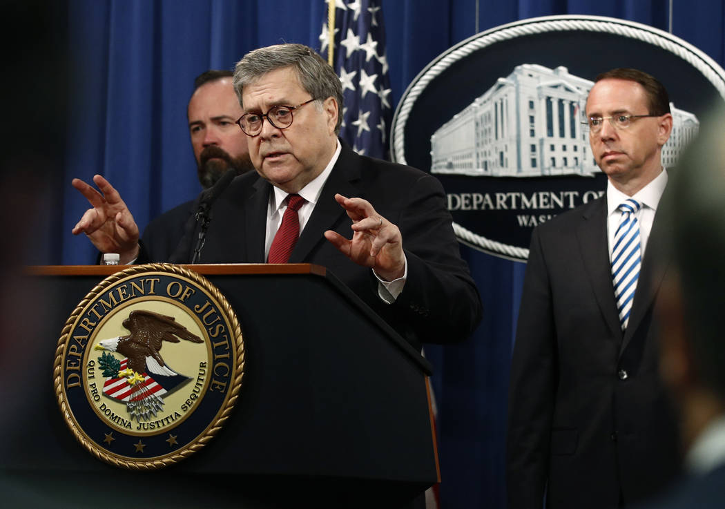 Attorney General William Barr speaks alongside Deputy Attorney General Rod Rosenstein, right, a ...