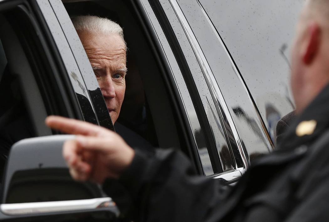 Former vice president Joe Biden looks out the car window as he leaves after speaking at a rally ...