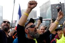 Jerome Rodriguez, center, a prominent figure of the yellow vests movement takes part in a rally ...