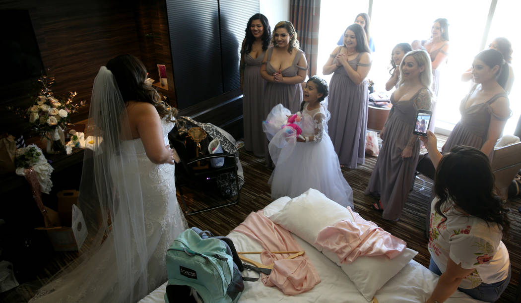 Bride Kimberly King with her bridesmaids in her room at the M Resort in Henderson Friday, April ...