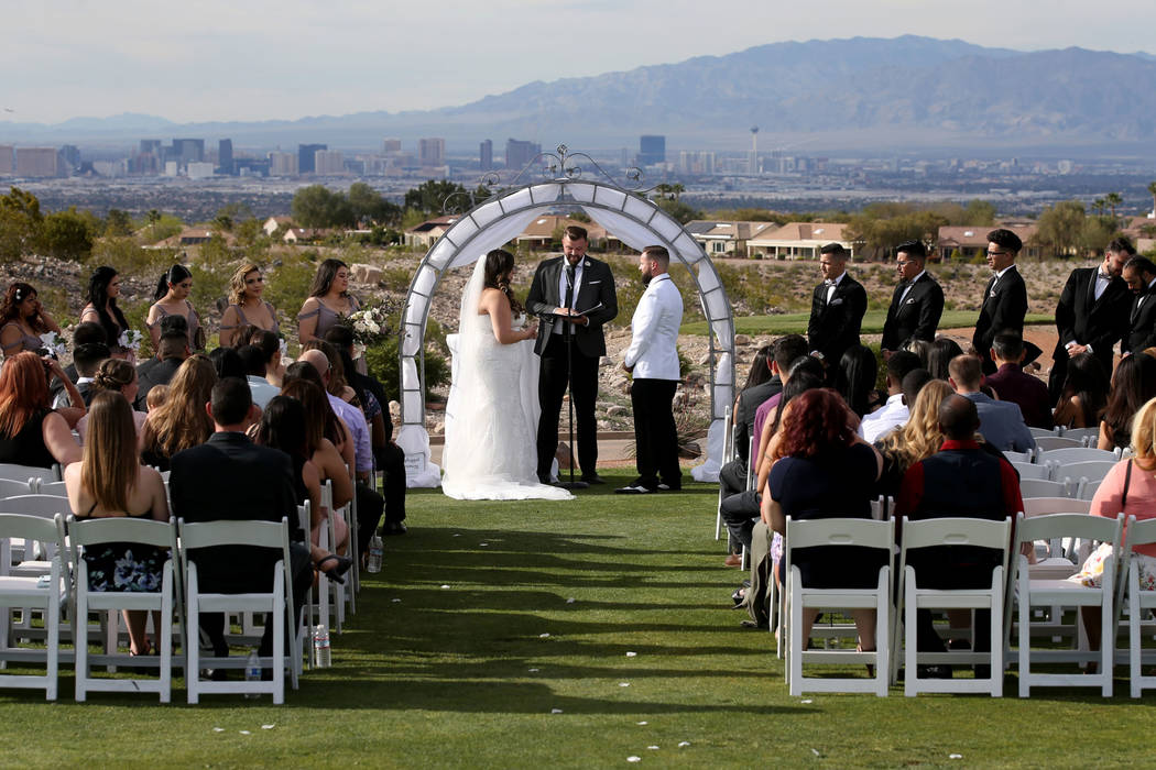 Kimberly and William King exchange vows at The Revere Golf Club in Henderson Friday, April 19, ...