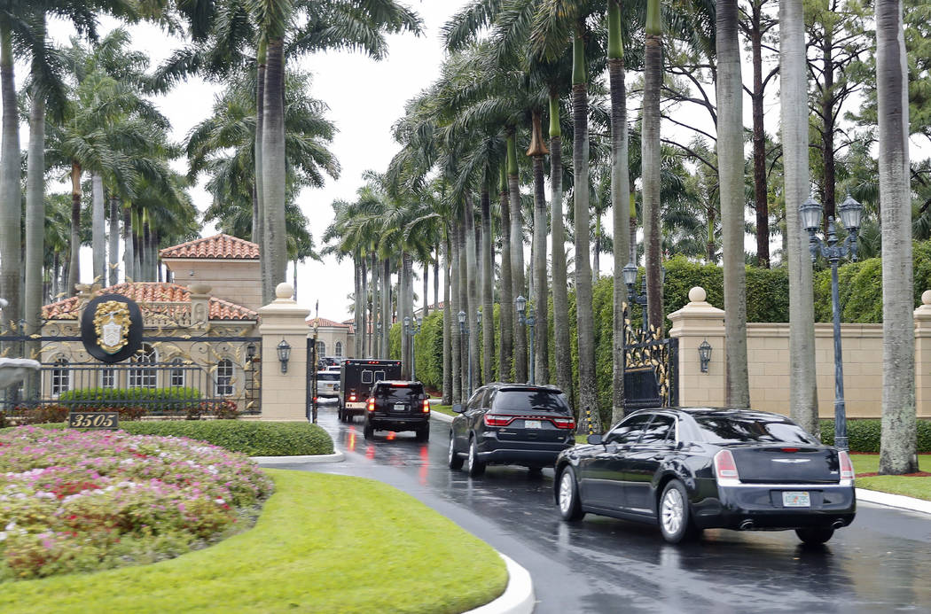 President Donald Trump and his accompanying motorcade vehicles arrive at Trump International Go ...