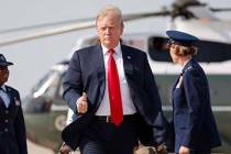 President Donald Trump gives a 'thumbs-up' as he prepares to board Air Force One, Thursday, Apr ...