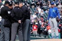 Kansas City Royals starting pitcher Brad Keller, right, looks at the umpires after Chicago Whit ...