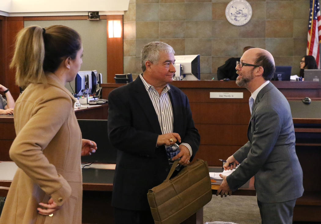 Henderson Constable Earl Mitchell, center, prepares to leave the courtroom with his attorneys, ...