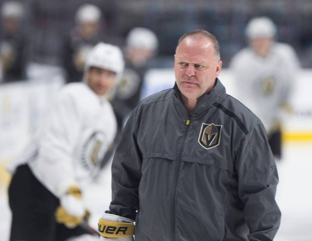 Golden Knights head coach Gerard Gallant warms up with his team during morning skate on Friday, ...