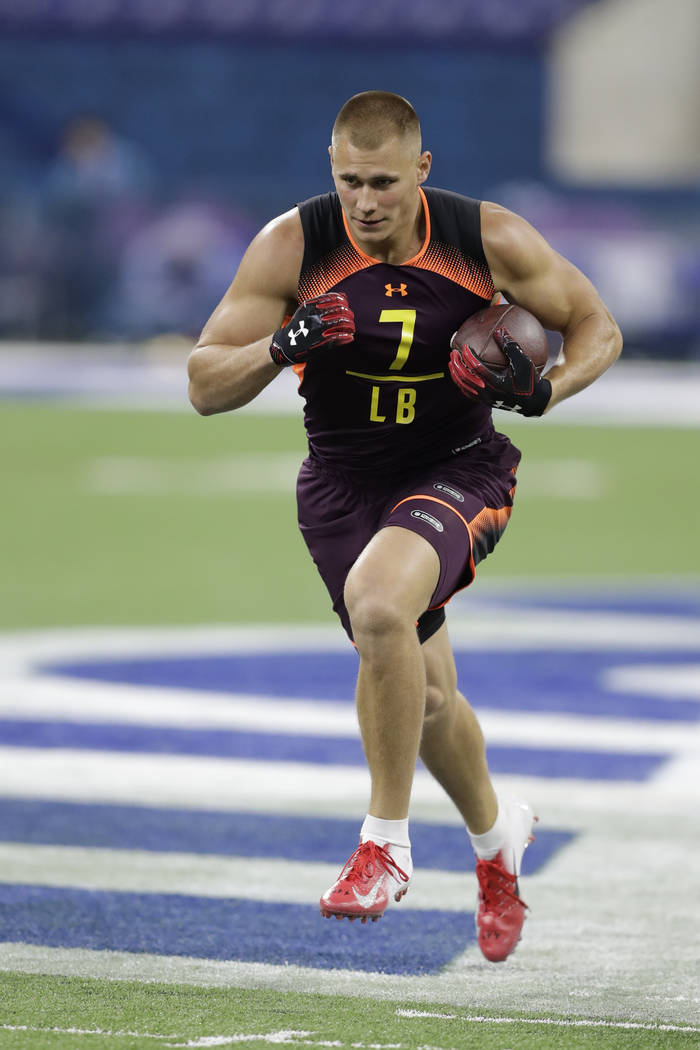 Utah linebacker Cody Barton runs a drill during the NFL football scouting combine, Sunday, Marc ...