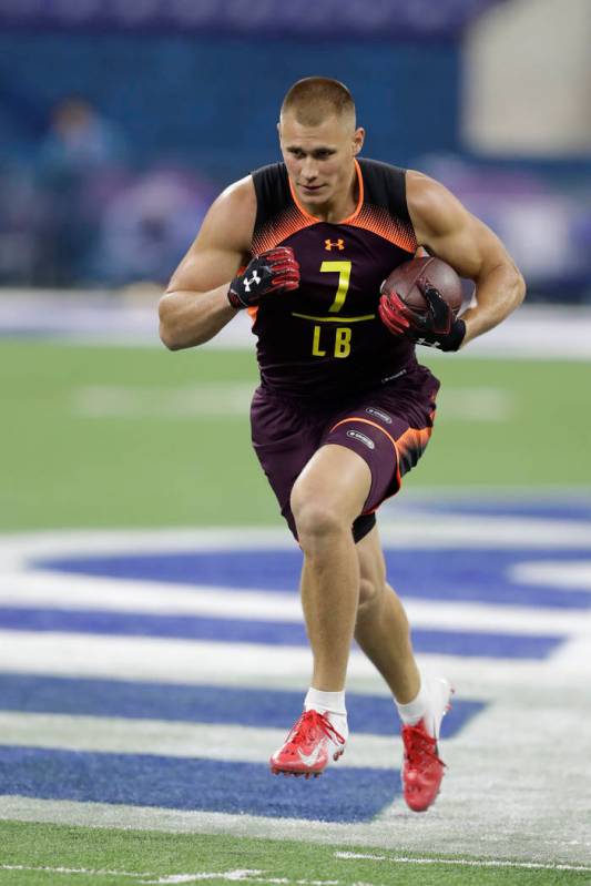 Utah linebacker Cody Barton runs a drill during the NFL football scouting combine, Sunday, Marc ...