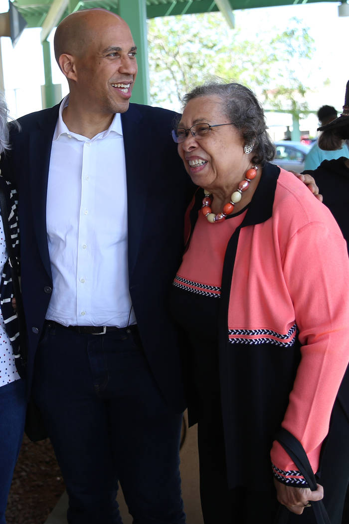 Democratic presidential candidate Sen. Cory Booker, D-N.J., left, with his mother Carolyn, embr ...
