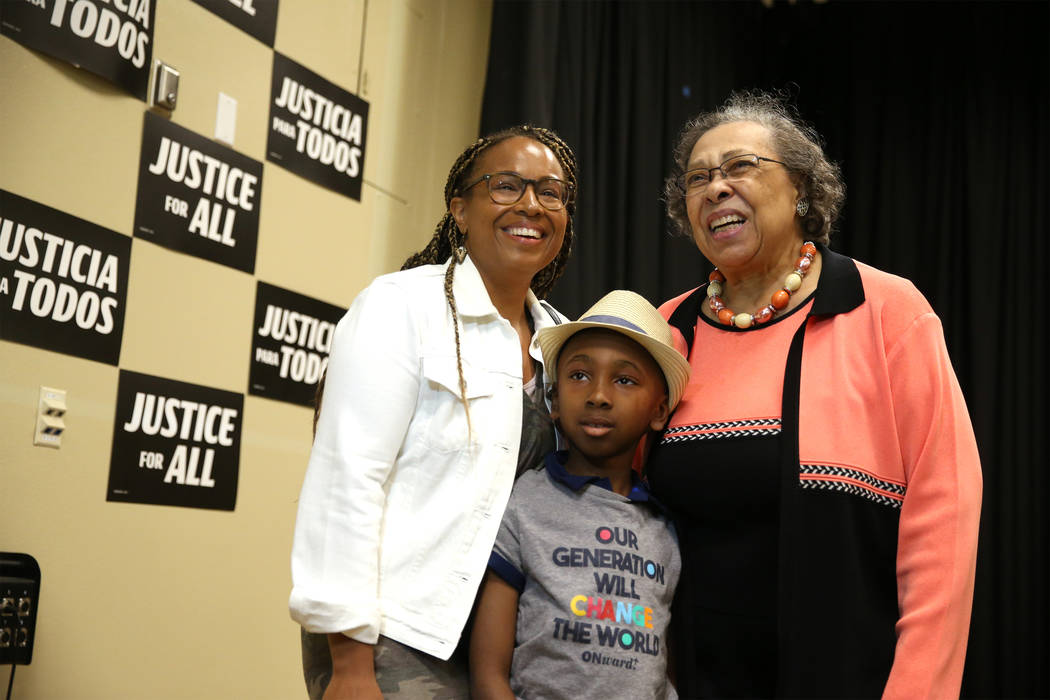 Demetria Giles, from left, with her son Justice Santiago, 7, of Las Vegas, take a photo with Ca ...