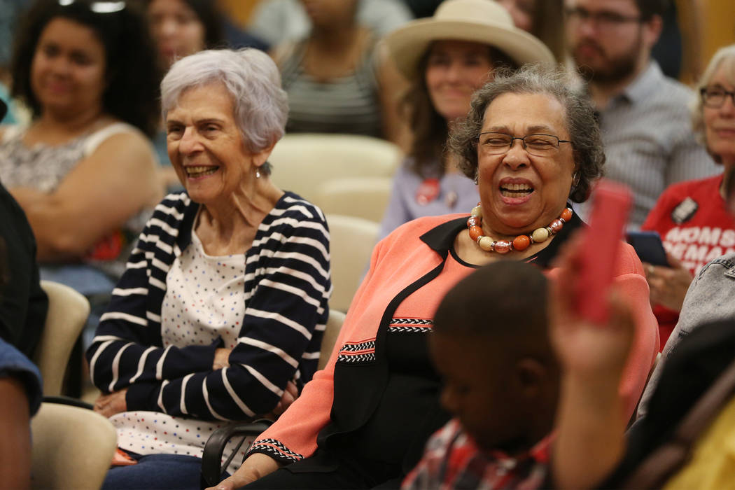 Carolyn Booker, right, laughs as his son, Democratic presidential candidate Sen. Cory Booker, D ...