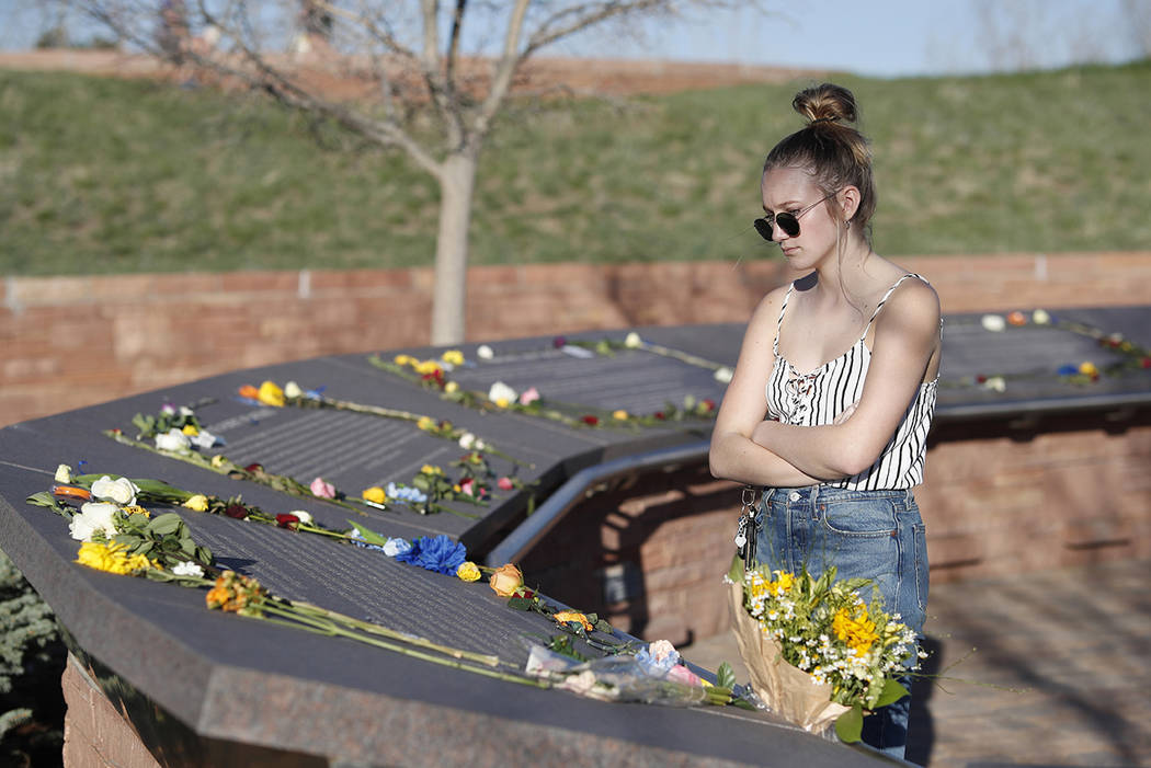 Sixteen-year-old Maren Strother of Denver looks over the plaques for the victims of the Columbi ...