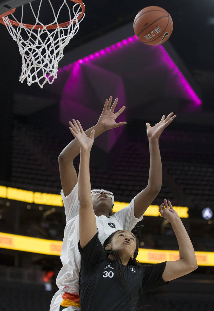 Francesca Belibi (1) attempts a dunk over Haley Jones (30) in the fourth quarter during the Jor ...