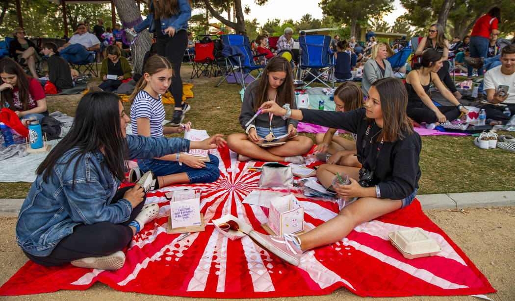 Lanterns are decorated before the launch during the Water Lantern Festival at Sunset Park on Sa ...