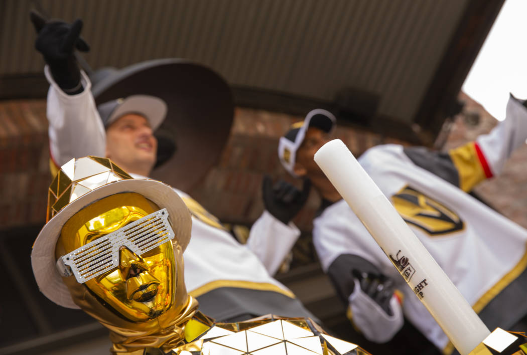 Costumed characters gather for photos for the fans before the first period start of Game 6 of a ...
