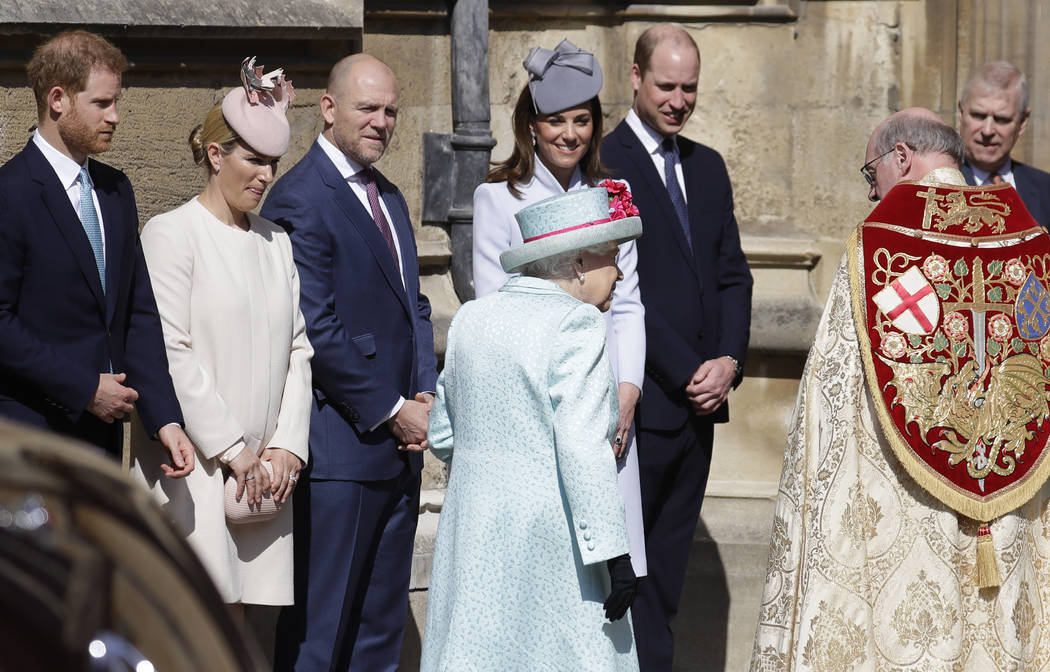 Members of Britain's Royal family watch as Britain's Queen Elizabeth II arrives to attend the E ...