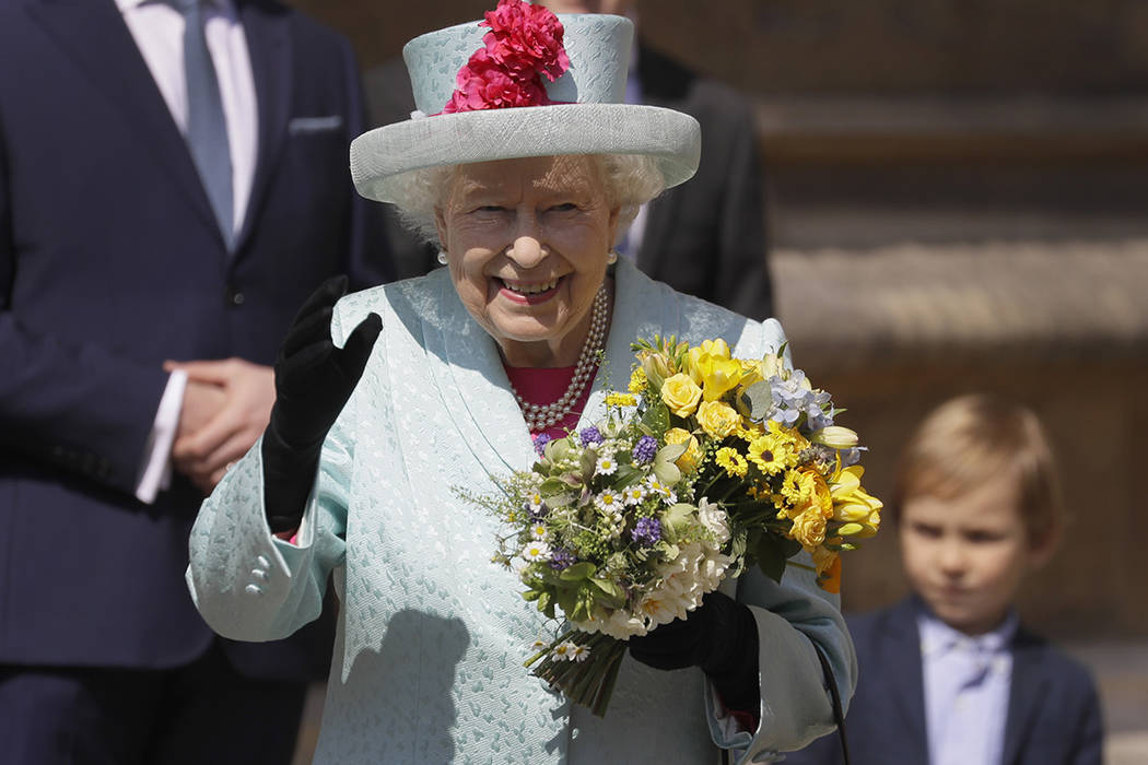 Britain's Queen Elizabeth II waves to the public as she leaves after attending the Easter Matti ...