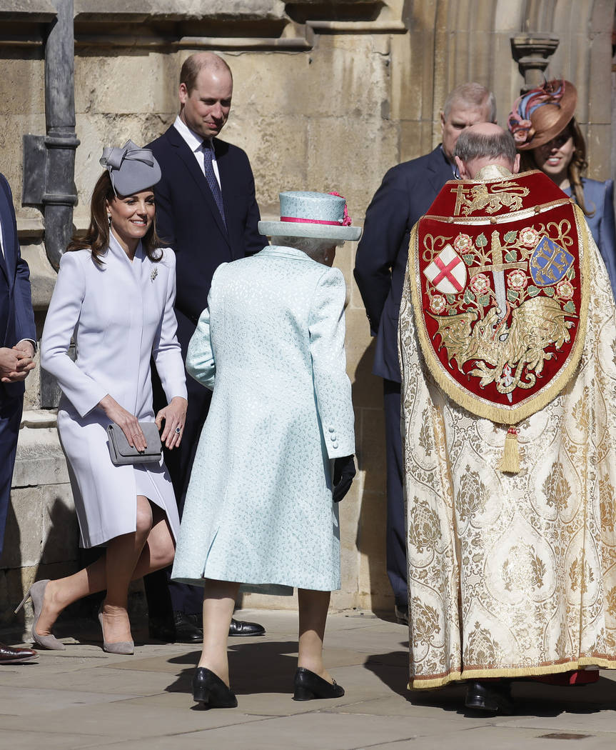 Britain's Kate, The Duchess of Cambridge curtsies as Britain's Queen Elizabeth II arrives to at ...