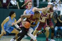 Florida State guard Trent Forrest (3) runs with the ball against Tulane guard Moses Wood during ...