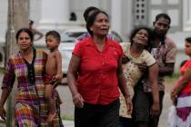 Relatives of a blast victim grieve outside a morgue in Colombo, Sri Lanka, Sunday, April 21, 20 ...