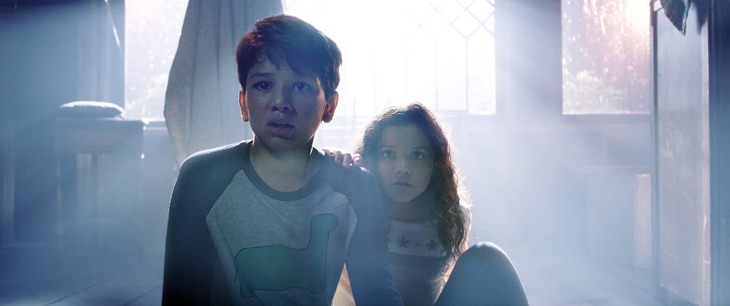 This image released by Warner Bros. Pictures shows Roman Christou, left, and Jaynee-Lynne Kinch ...