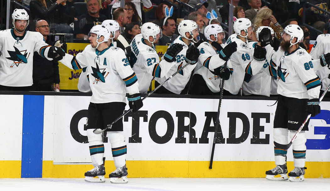 San Jose Sharks players including defenseman Brent Burns (88) celebrate a goal shot by center L ...