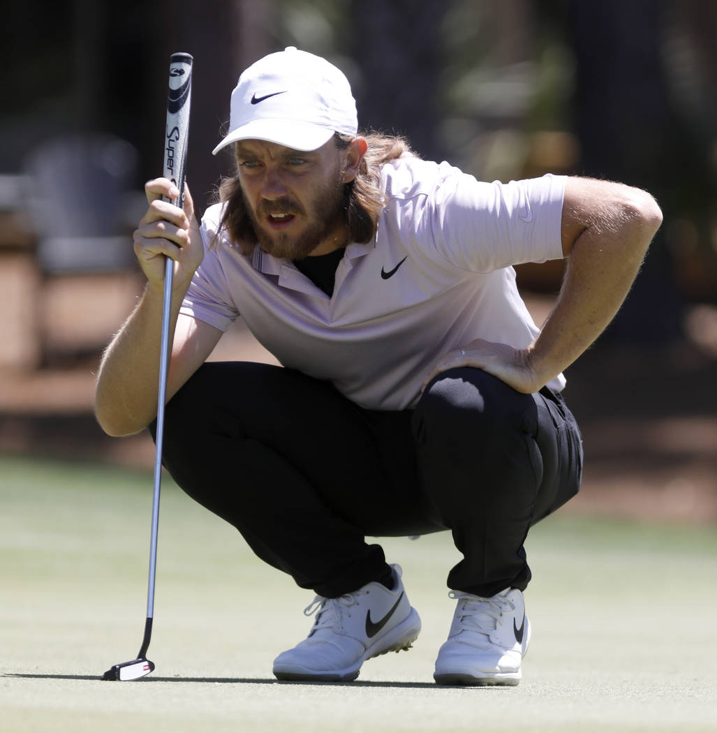 Tommy Fleetwood, from England, lines up his putt on the sixth green during the final round of t ...