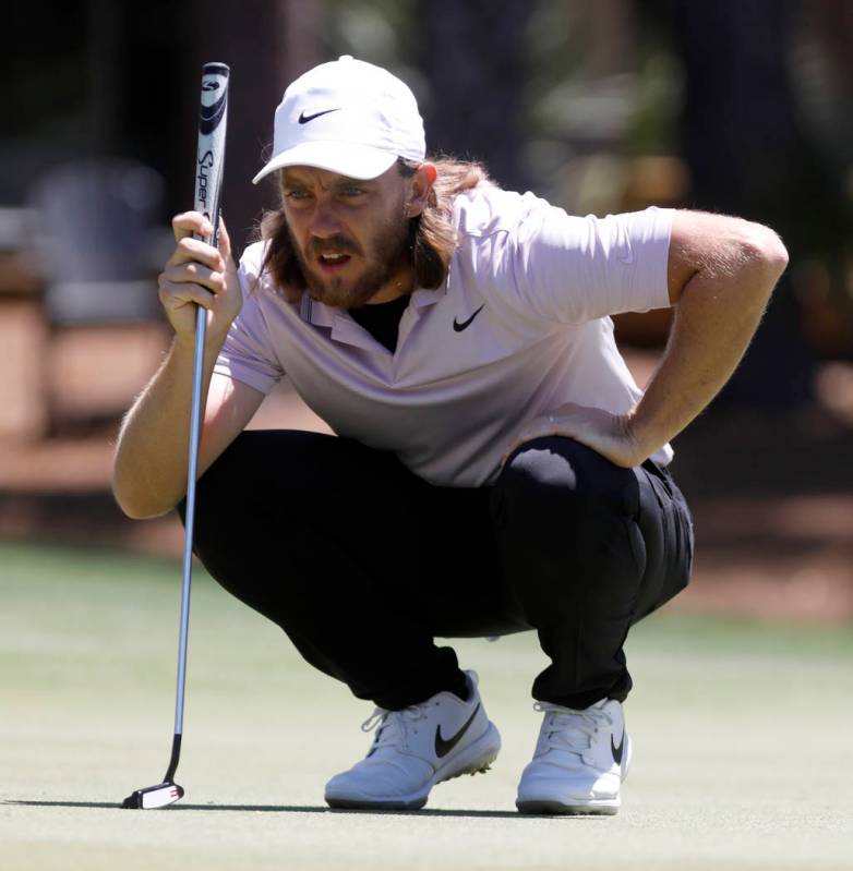 Tommy Fleetwood, from England, lines up his putt on the sixth green during the final round of t ...