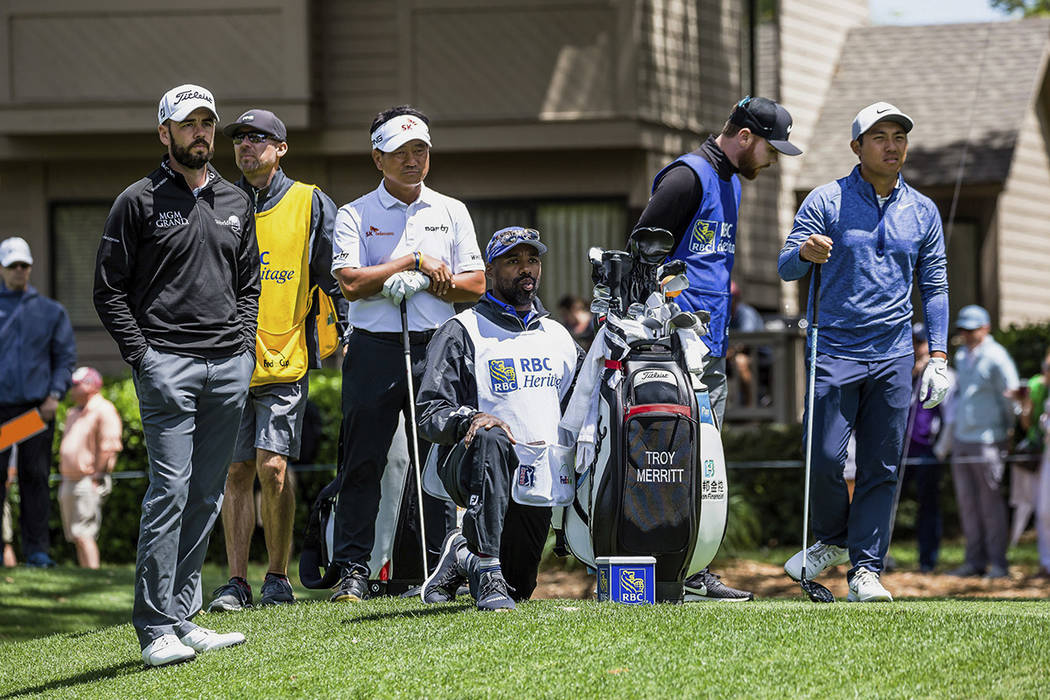 Troy Merritt, far left, K.J. Choi, third left, and C.T. Pan, far right, wait to tee off on the ...