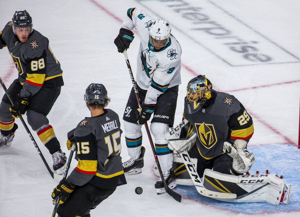 San Jose Sharks left wing Evander Kane (9) battles in close for a shot attempt over Golden Knig ...