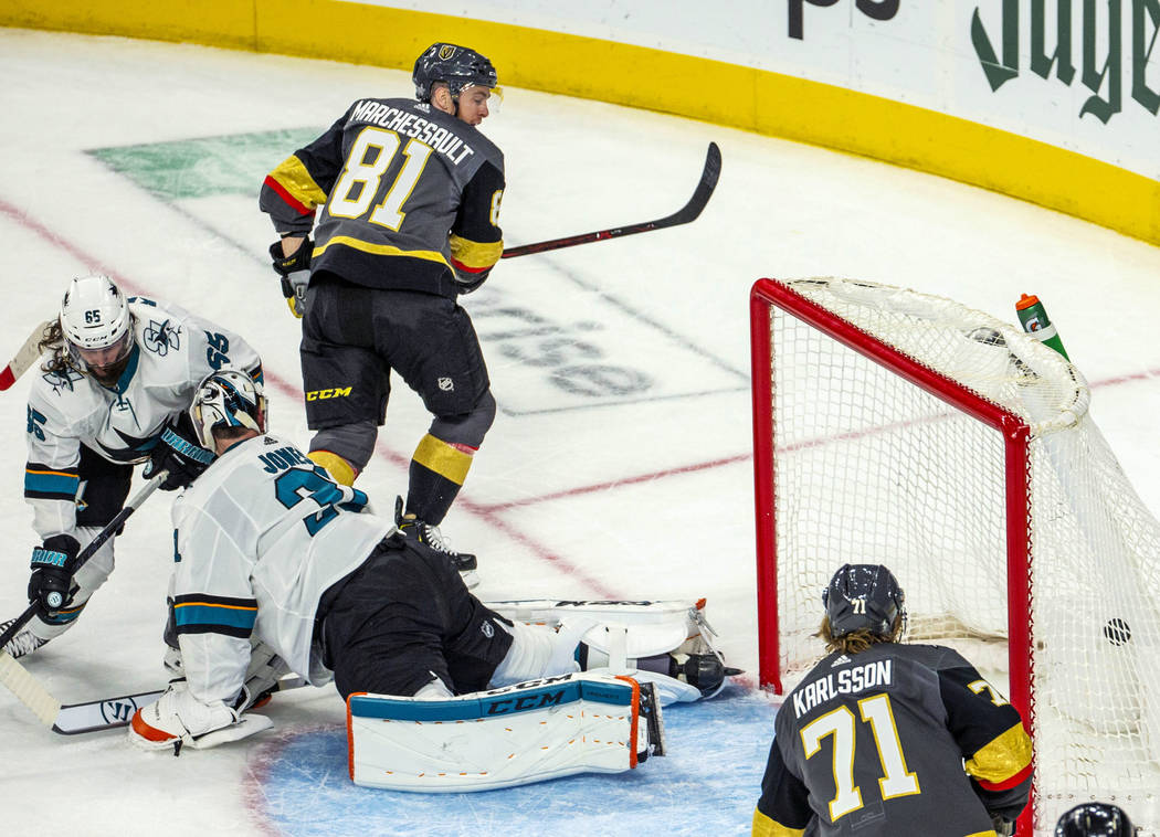 Golden Knights center Jonathan Marchessault (81) scores over San Jose Sharks goaltender Martin ...