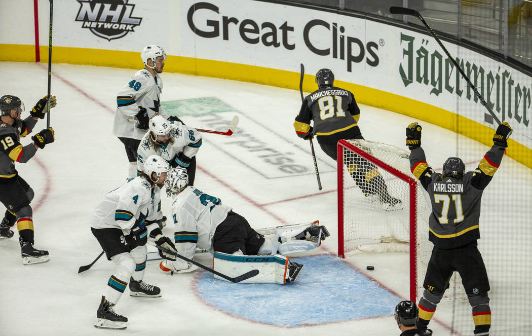 Golden Knights center Jonathan Marchessault (81) scores over San Jose Sharks goaltender Martin ...