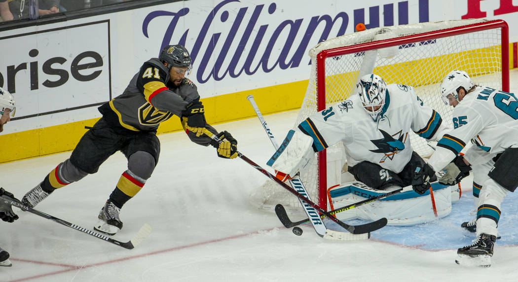 Golden Knights center Pierre-Edouard Bellemare (41) looks to sneak in a goal over San Jose Shar ...