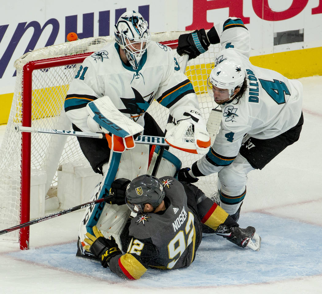 Golden Knights left wing Tomas Nosek (92) slides into San Jose Sharks goaltender Martin Jones ( ...