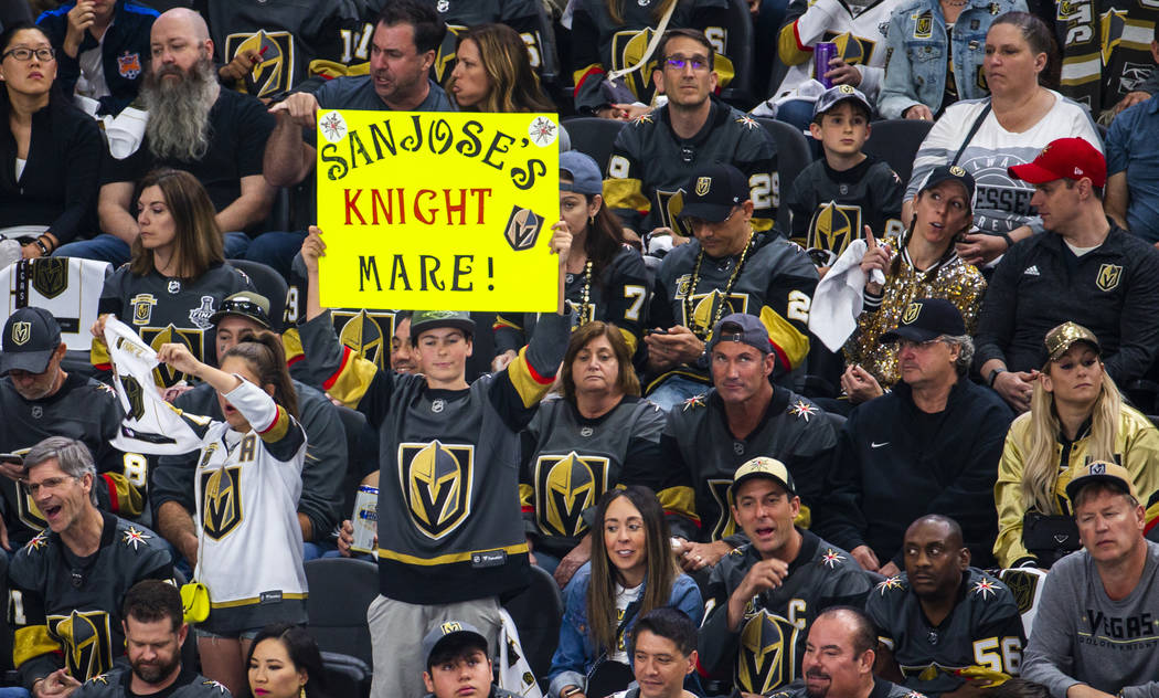 A fan makes his point to San Jose players during the first period of Game 6 of an NHL Western C ...