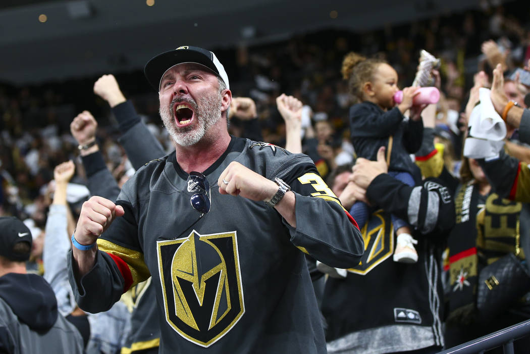 Golden Knights fans celebrate a goal by Golden Knights center Jonathan Marchessault, not pictur ...