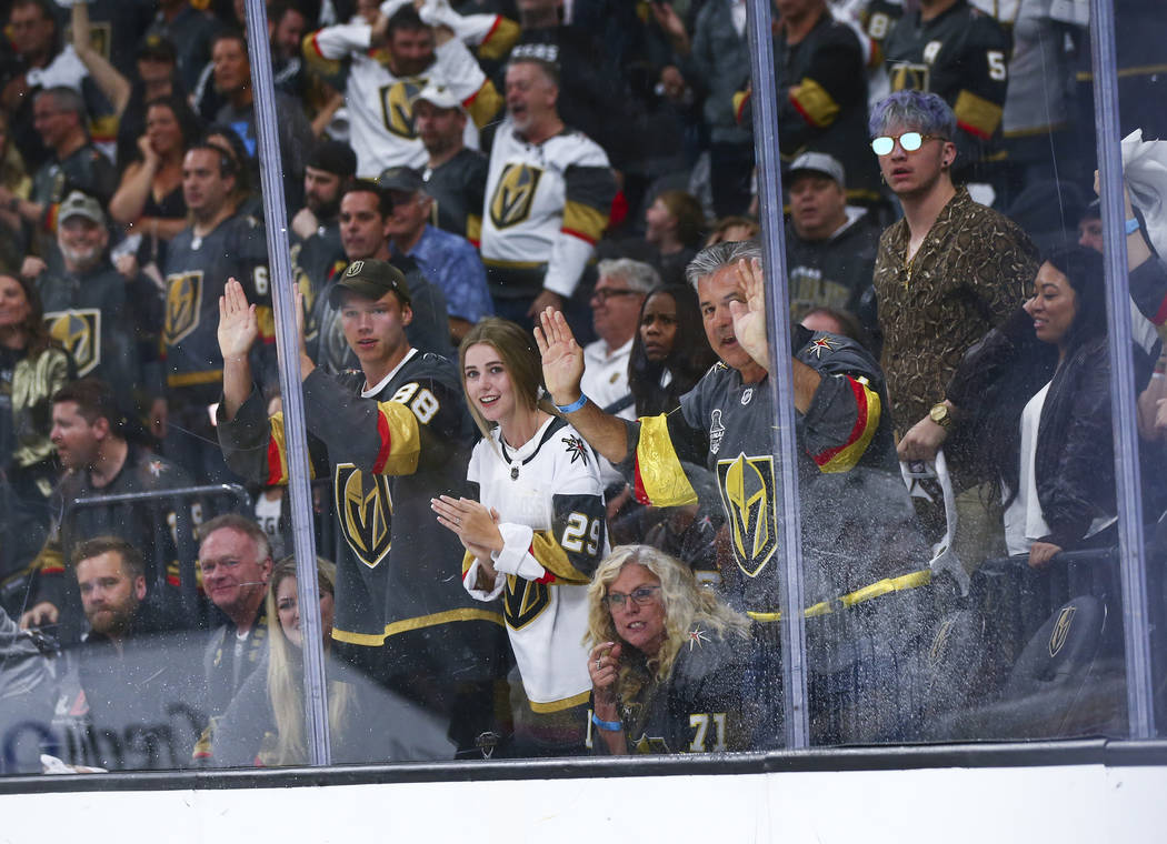 Golden Knights fans cheer during the first overtime period of Game 6 of an NHL Western Conferen ...