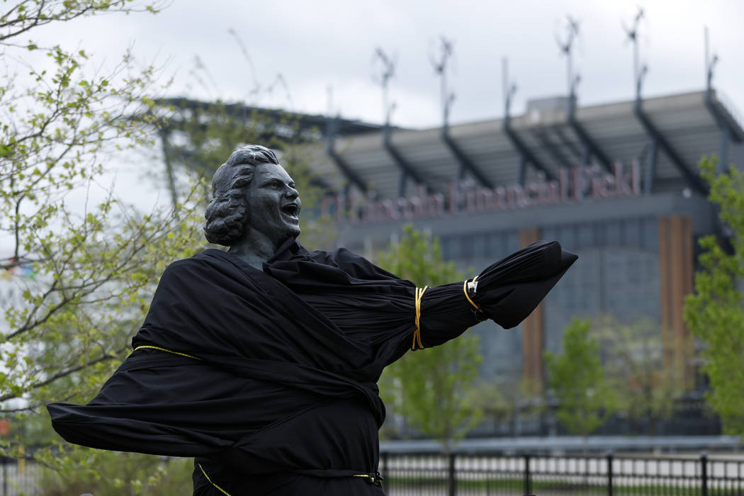 A partially covered statue of singer Kate Smith is seen near the Wells Fargo Center, Friday, Ap ...