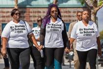 Consuela Nicole, left, Akiko Cooks and Jshauntae Marshall walk hand-in-hand outside the Clark C ...