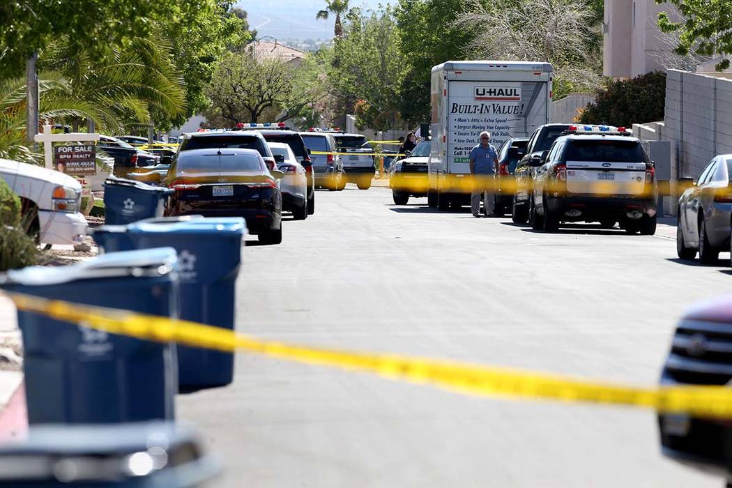 Las Vegas police investigate a shooting in 8500 block of Honey Vine Avenue, near North Durango ...